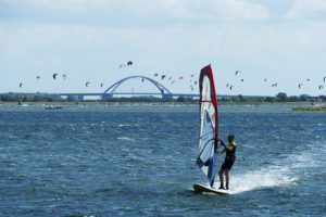 Surfer in front of the Fehmarnsoundbridge off the Island of Fehmarn