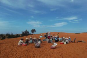 Vendors on the Red Dune of Mui Ne in Vietnam