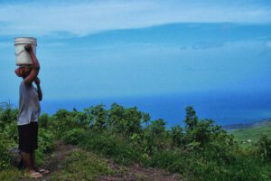 Woman overlooking the ocean on the island of Fogo, Cape Verde