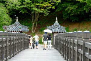 People crossing the Woryeonggyo Bridge in Andong.