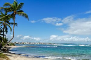 View of the town of Le Moule from the adjacent Plage de l'Autre Bord. One of the Best Things to do in Grand Terre even by Public Bus.