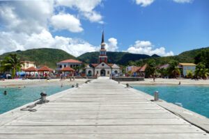 Pier and beach of Anse d'Arlet, one of ten places not to miss when visiting Martinique.