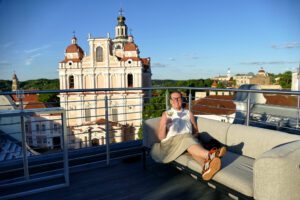 Renata Green in Vilnius on the roof top terrace of the Radisson Collection Astorija Hotel across from the iconic Church of St. Casimir.
