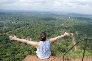 Renata Green sitting on the Lion Rock of Sigiriya before a daytrip to Dambulla