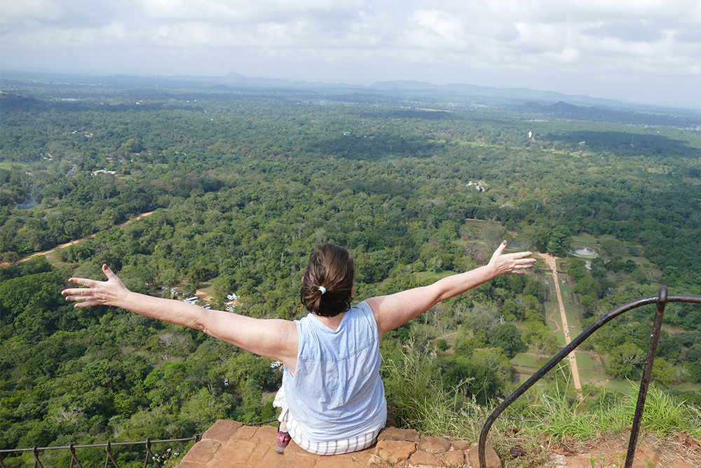 Renata Green sitting on the Lion Rock of Sigiriya before a daytrip to Dambulla